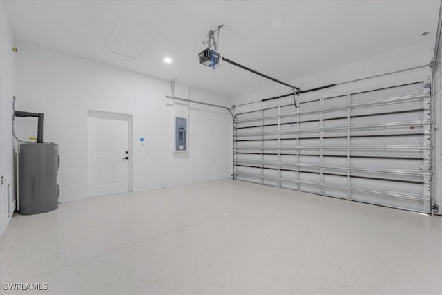 915 Anthony St E, Lehigh Acres, FL 33974 - garage featuring electric panel, water heater, a garage door opener, and recessed lighting