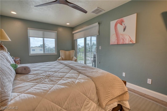 6008 Cypress Ln, Bonita Springs, FL 34134 - bedroom with access to exterior, wood finished floors, recessed lighting, and ceiling fan