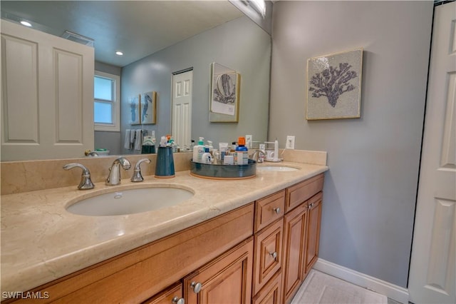 6008 Cypress Ln, Bonita Springs, FL 34134 - bathroom featuring double vanity and baseboards