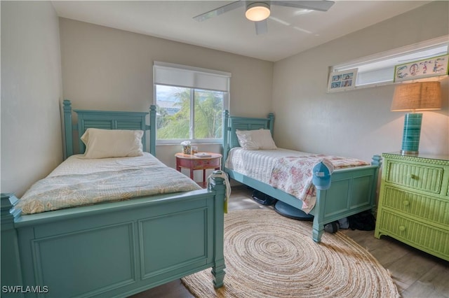 6008 Cypress Ln, Bonita Springs, FL 34134 - bedroom with wood finished floors and ceiling fan