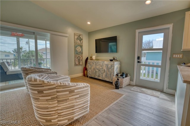 6008 Cypress Ln, Bonita Springs, FL 34134 - living room featuring light wood-style floors, lofted ceiling, and recessed lighting