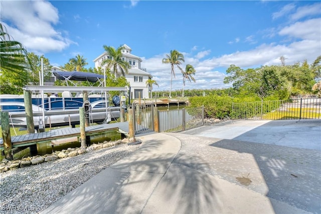 6008 Cypress Ln, Bonita Springs, FL 34134 - dock area with boat lift and a water view