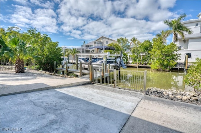 6008 Cypress Ln, Bonita Springs, FL 34134 - dock area featuring a water view