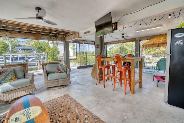 6008 Cypress Ln, Bonita Springs, FL 34134 - sunroom featuring a ceiling fan, an outdoor living space, and healthy amount of natural light