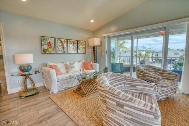 6008 Cypress Ln, Bonita Springs, FL 34134 - living room featuring vaulted ceiling, wood finished floors, and recessed lighting