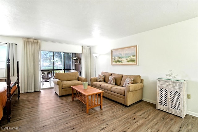2079 Barkeley Ln Unit 6, Fort Myers, FL 33907 - living room with wood finished floors and baseboards