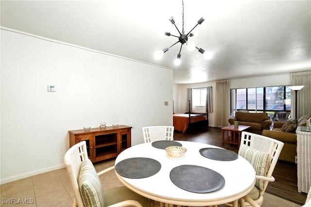 2079 Barkeley Ln Unit 6, Fort Myers, FL 33907 - dining room featuring a chandelier and baseboards