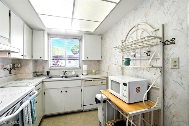 2079 Barkeley Ln Unit 6, Fort Myers, FL 33907 - kitchen with white appliances, light countertops, white cabinets, tasteful backsplash, and premium range hood
