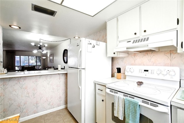 2079 Barkeley Ln Unit 6, Fort Myers, FL 33907 - kitchen featuring white appliances, under cabinet range hood, light countertops, light tile patterned floors, and white cabinets