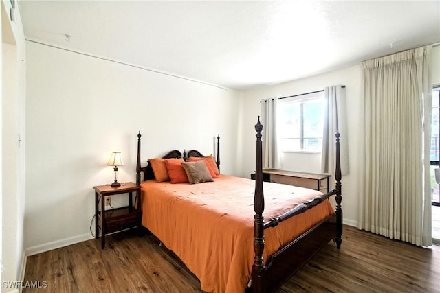 2079 Barkeley Ln Unit 6, Fort Myers, FL 33907 - bedroom featuring dark wood-type flooring and baseboards