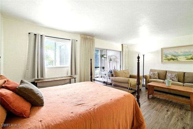 2079 Barkeley Ln Unit 6, Fort Myers, FL 33907 - bedroom with wood finished floors and access to exterior