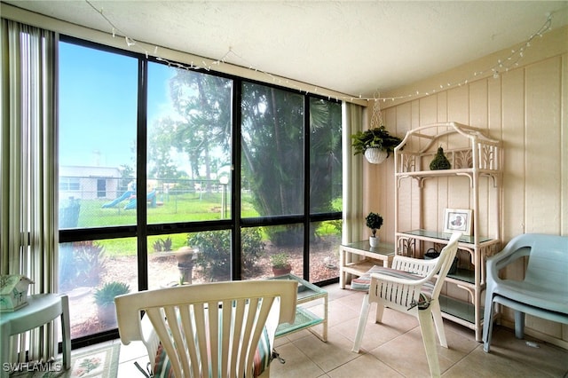 2079 Barkeley Ln Unit 6, Fort Myers, FL 33907 - sunroom featuring plenty of natural light, tile patterned floors, and expansive windows