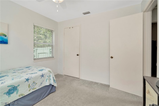 1308 Hull St S, Gulfport, FL 33707 - bedroom featuring light colored carpet and ceiling fan