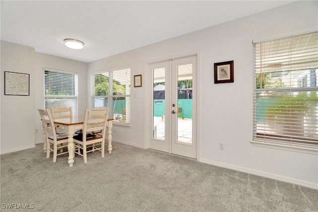 1308 Hull St S, Gulfport, FL 33707 - carpeted dining room with french doors and baseboards