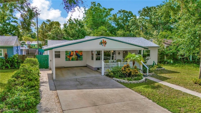 1308 Hull St S, Gulfport, FL 33707 - bungalow-style house with concrete driveway, covered porch, and an attached carport