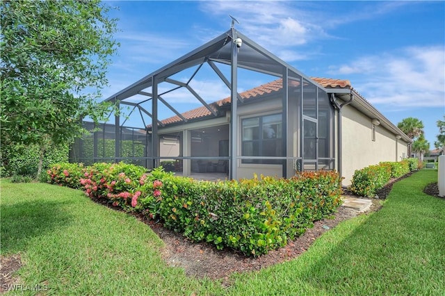 8142 Lucello Ter S, Naples, FL 34114 - back of house with a tiled roof, a lawn, and stucco siding