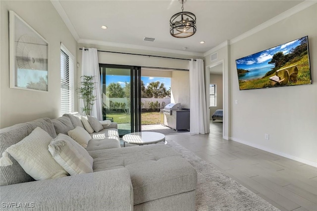 14712 Kingfisher Loop, Naples, FL 34120 - living area with healthy amount of natural light, a chandelier, crown molding, and recessed lighting