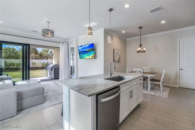 14712 Kingfisher Loop, Naples, FL 34120 - kitchen featuring dishwasher, open floor plan, a chandelier, light stone countertops, and white cabinets