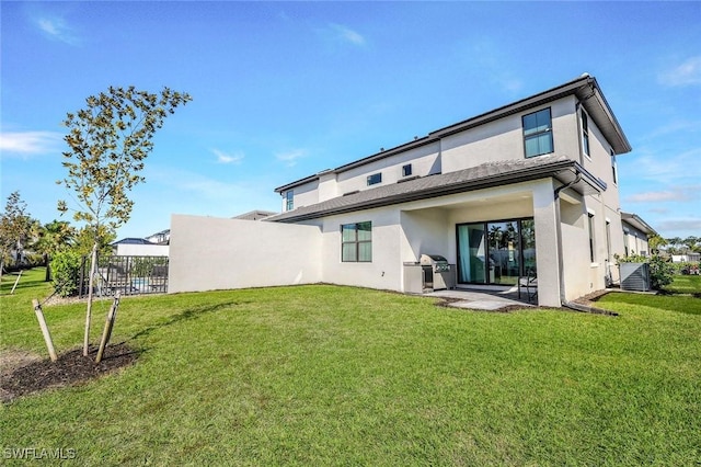 14712 Kingfisher Loop, Naples, FL 34120 - back of property with stucco siding and a patio