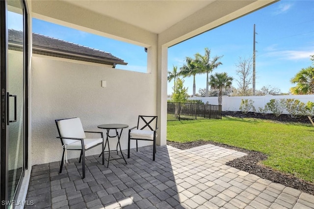 14712 Kingfisher Loop, Naples, FL 34120 - fenced backyard with a patio