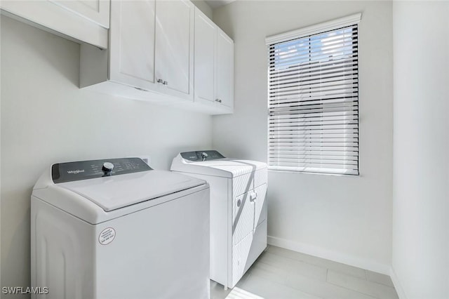 14712 Kingfisher Loop, Naples, FL 34120 - washroom with washer and dryer and cabinet space