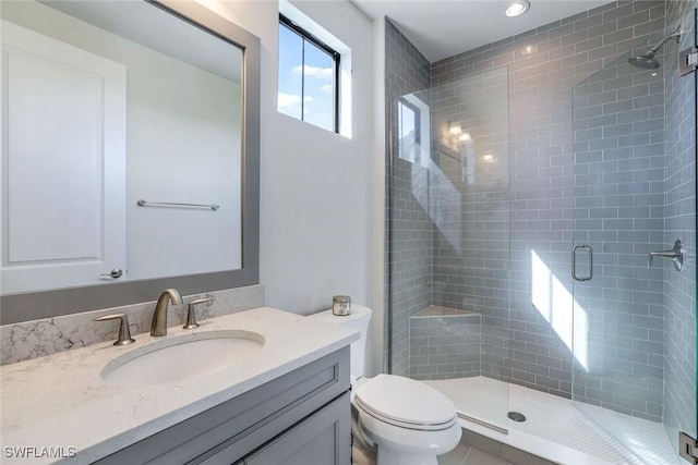 14712 Kingfisher Loop, Naples, FL 34120 - bathroom with vanity, a shower stall, and recessed lighting