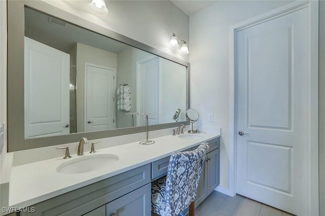 14712 Kingfisher Loop, Naples, FL 34120 - full bathroom with double vanity and tile patterned floors