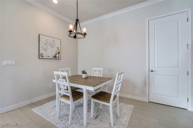 14712 Kingfisher Loop, Naples, FL 34120 - dining area with a chandelier, crown molding, and recessed lighting