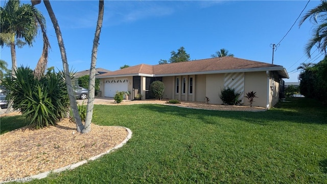 169 SE 21st St, Cape Coral, FL 33990 - ranch-style home with stucco siding, an attached garage, driveway, and a front yard