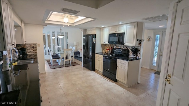 169 SE 21st St, Cape Coral, FL 33990 - kitchen with black appliances, decorative backsplash, dark countertops, light tile patterned floors, and recessed lighting