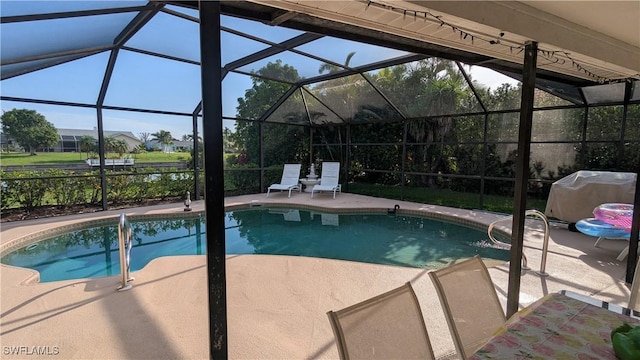 169 SE 21st St, Cape Coral, FL 33990 - swimming pool with a patio, a grill, and glass enclosure