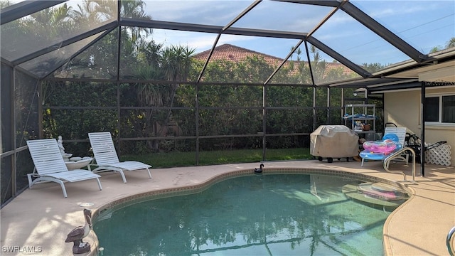169 SE 21st St, Cape Coral, FL 33990 - outdoor pool featuring a lanai, area for grilling, and a patio