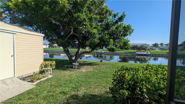 169 SE 21st St, Cape Coral, FL 33990 - view of green lawn featuring a water view