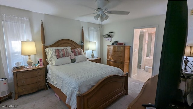 169 SE 21st St, Cape Coral, FL 33990 - bedroom featuring light colored carpet, ceiling fan, and ensuite bathroom