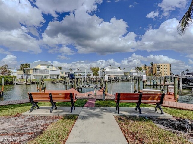 4431 Bay Beach Ln Unit 522, Fort Myers Beach, FL 33931 - view of property's community featuring boat lift, a boat dock, a water view, and a residential view