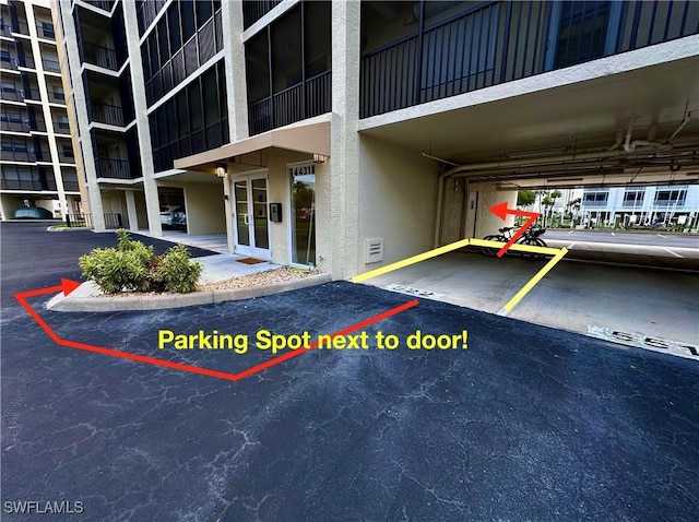 4431 Bay Beach Ln Unit 522, Fort Myers Beach, FL 33931 - exterior space featuring covered parking