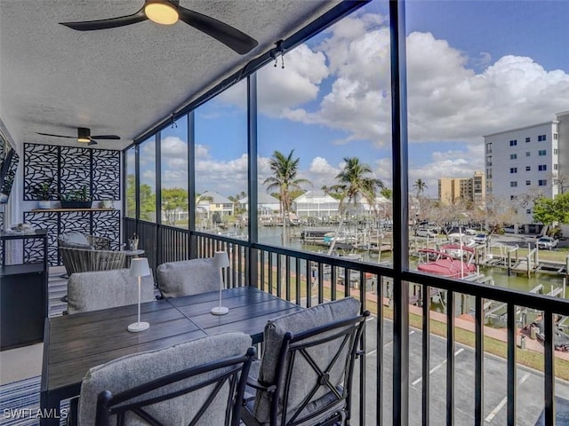 4431 Bay Beach Ln Unit 522, Fort Myers Beach, FL 33931 - sunroom / solarium with a ceiling fan and a water view