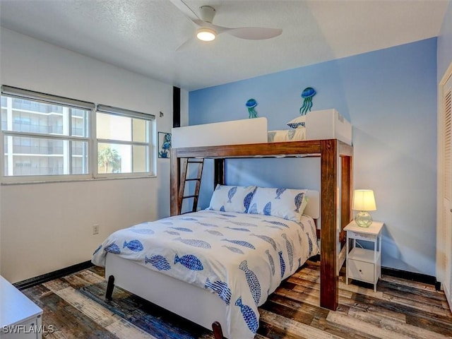 4431 Bay Beach Ln Unit 522, Fort Myers Beach, FL 33931 - bedroom with wood finished floors and a ceiling fan