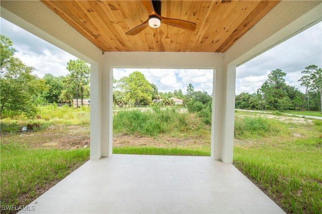 3407 E 5th St, Lehigh Acres, FL 33972 - view of patio with a ceiling fan and view of wooded area
