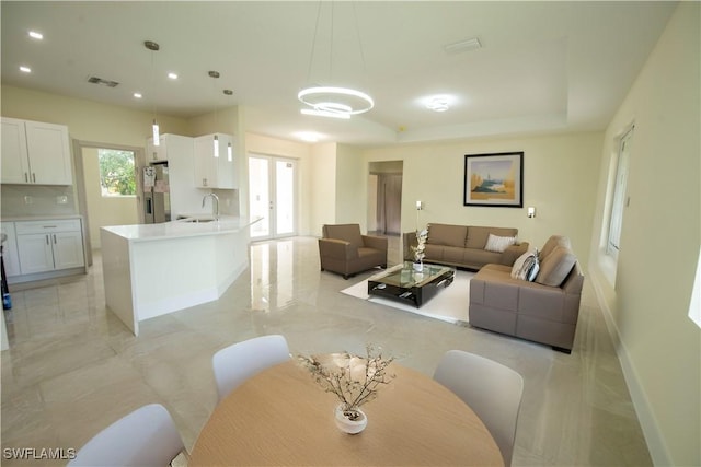 3407 E 5th St, Lehigh Acres, FL 33972 - living area featuring recessed lighting and a tray ceiling