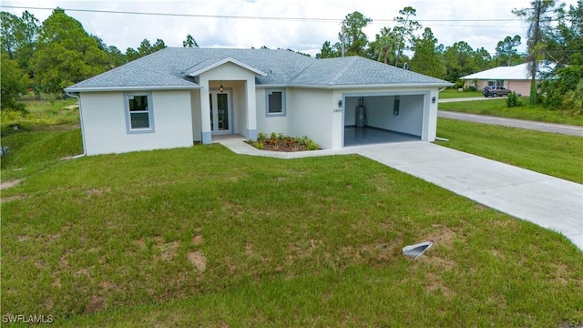 3407 E 5th St, Lehigh Acres, FL 33972 - ranch-style home featuring a garage, concrete driveway, a front lawn, and stucco siding