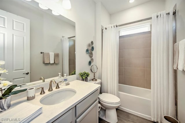 3649 Avenida Del Vera, North Fort Myers, FL 33917 - bathroom with vanity, shower / bathtub combination with curtain, and wood finished floors