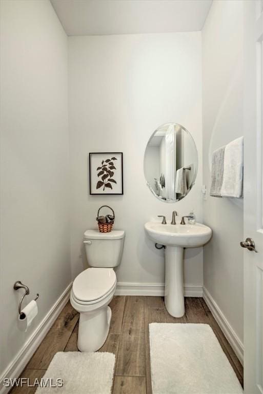 3649 Avenida Del Vera, North Fort Myers, FL 33917 - bathroom with toilet and wood finished floors