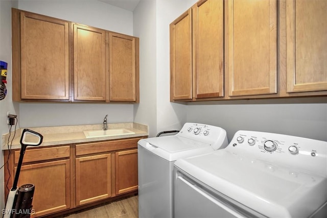 3649 Avenida Del Vera, North Fort Myers, FL 33917 - laundry room with cabinet space, independent washer and dryer, and light wood-type flooring