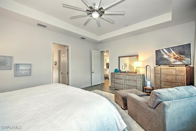 3649 Avenida Del Vera, North Fort Myers, FL 33917 - bedroom with a tray ceiling, wood finished floors, and ceiling fan