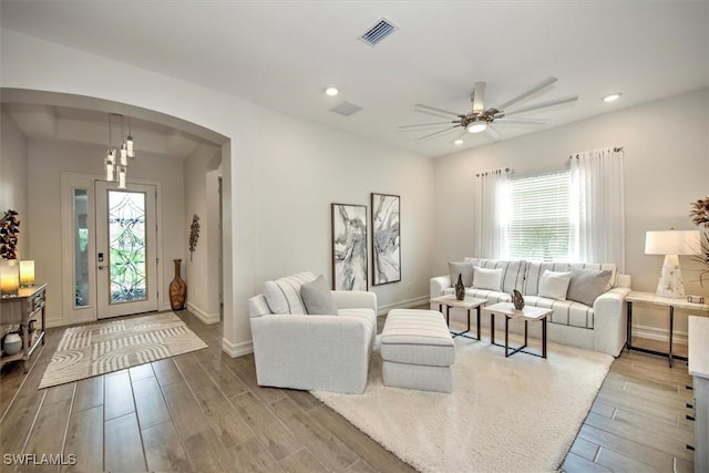 3649 Avenida Del Vera, North Fort Myers, FL 33917 - living area with arched walkways, wood finished floors, ceiling fan, and recessed lighting