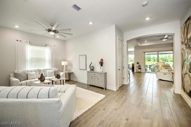 3649 Avenida Del Vera, North Fort Myers, FL 33917 - living room featuring a ceiling fan, arched walkways, recessed lighting, and light wood-type flooring