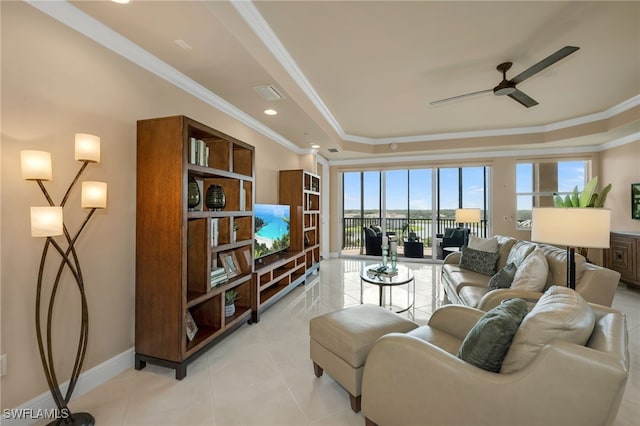 580 El Camino Real Unit 3606, Naples, FL 34119 - living area with a tray ceiling, ornamental molding, a ceiling fan, and light tile patterned flooring