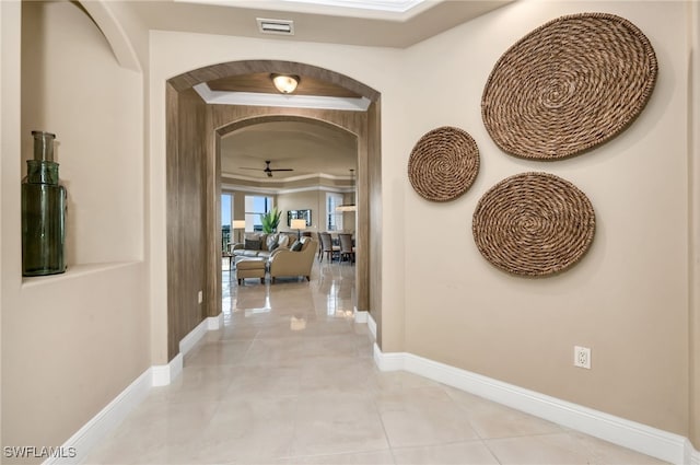 580 El Camino Real Unit 3606, Naples, FL 34119 - hallway featuring arched walkways and light tile patterned flooring