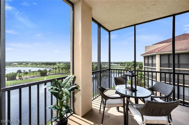 580 El Camino Real Unit 3606, Naples, FL 34119 - sunroom / solarium featuring a water view and expansive windows